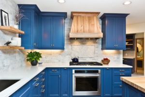 Home décor trends with blue kitchen cabinets and modern finishes